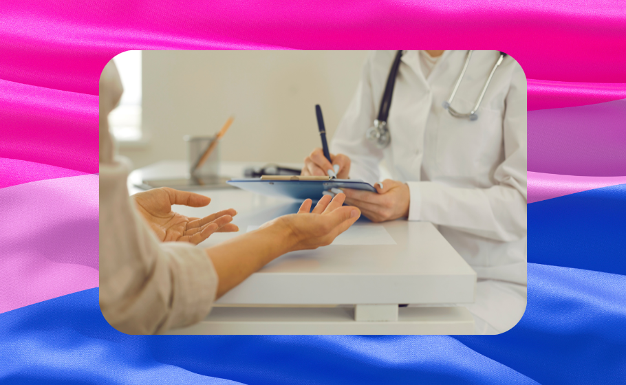 Closeup of a doctor in a white coat with a stethoscope writing on a clipboard while a patient gesturing with their hands across a desk, superimposed over a rippling bisexual flag of pink, purple and blue.